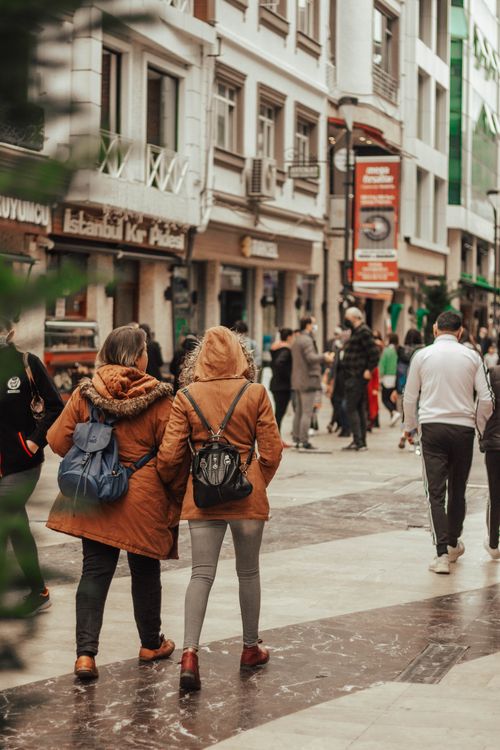 Free People walking in a bustling city street in Ordu, Türkiye with shops and urban buildings. Stock Photo
