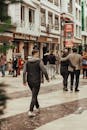 Man in Gray Coat Walking on Street