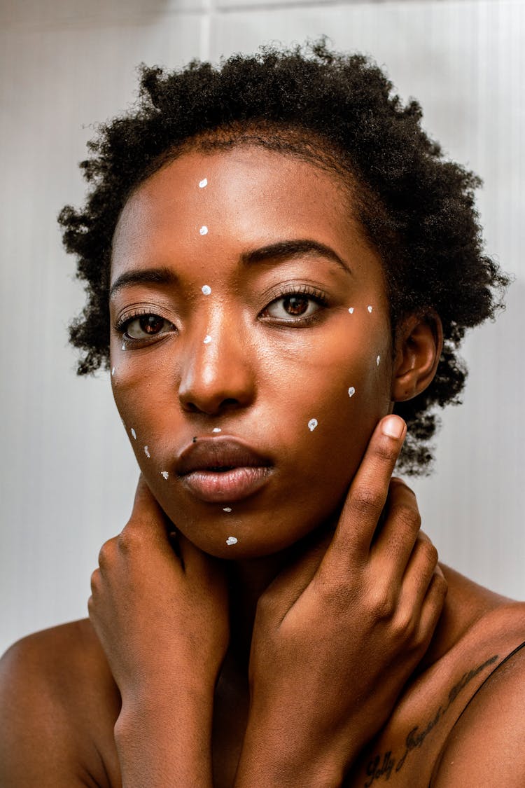 Portrait Of Woman With White Dots Painted On Her Face