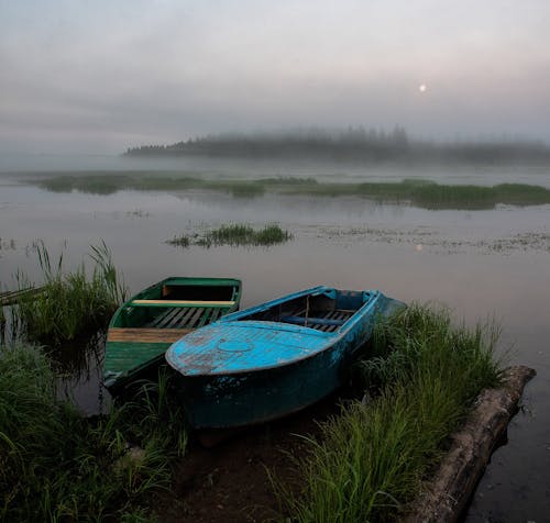 Two Rowboats on Lake on a Foggy Day