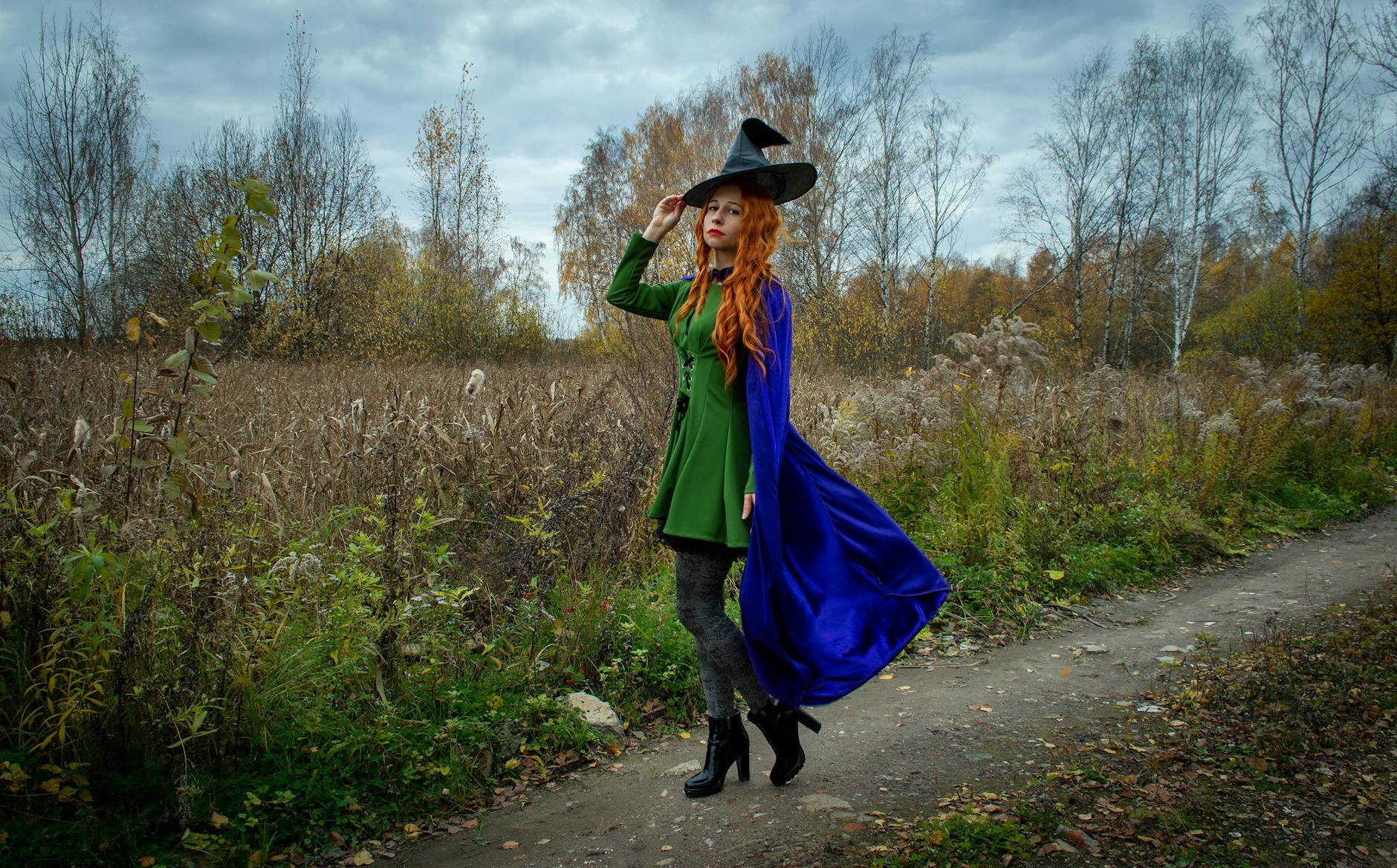 https://www.pexels.com/photo/woman-in-witch-costume-walking-in-an-upnaved-pathway-9919507/