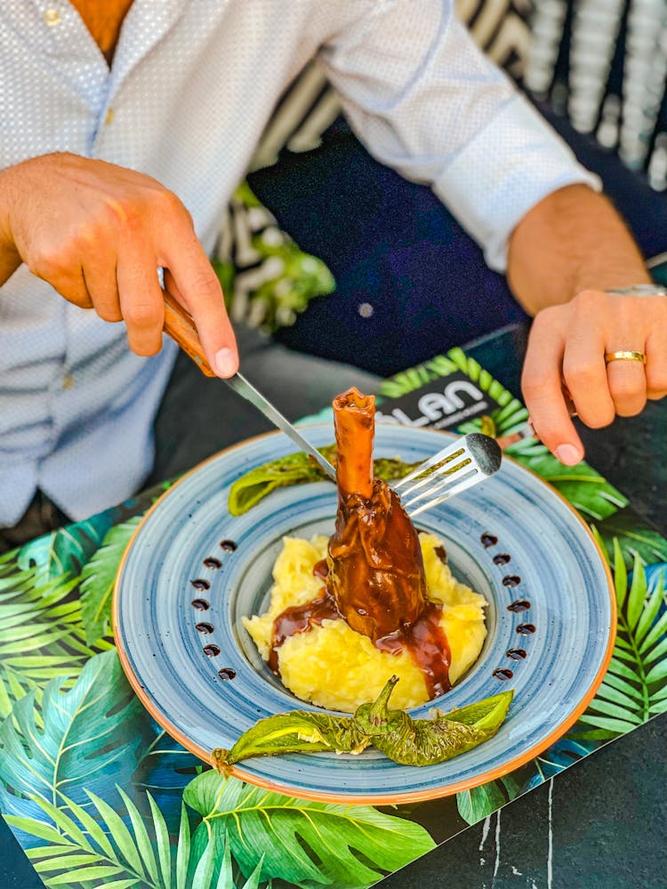 Person Eating Beef Shank Dish