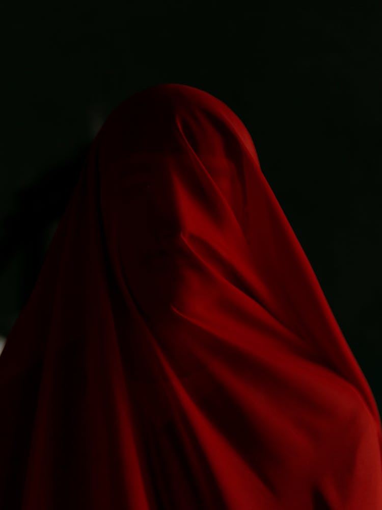 Portrait Of Person Covered In Red Fabric