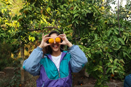 Woman Holding Oranges