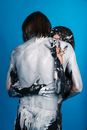 Couple With Painted Bodies Embracing