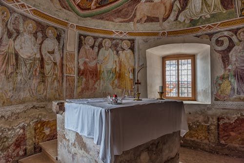 Altar in Church with Frescoes on Walls