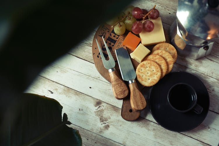 Rustic Cutting Board With Grapes, Cheese And Crackers