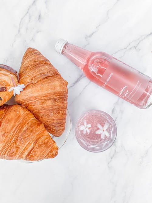 Free Jasmine Water and Croissants on Table Stock Photo