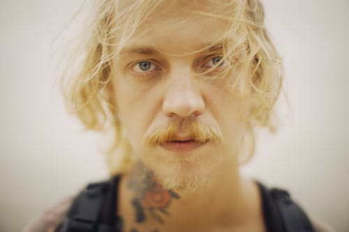 Blond Man with Tattoo on Neck