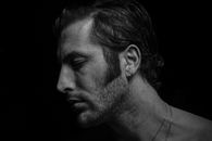 Man Wearing Earrings and Necklace