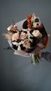 Unrecognized Hand Holding Bouquet of Pale Pink and White Flowers
