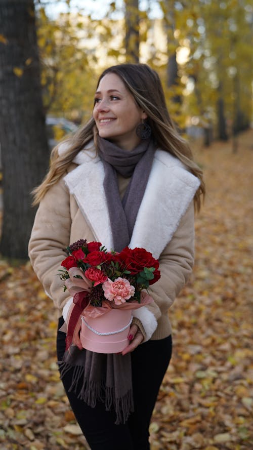 Woman in Beige Jacket Holding Rose Bouquet