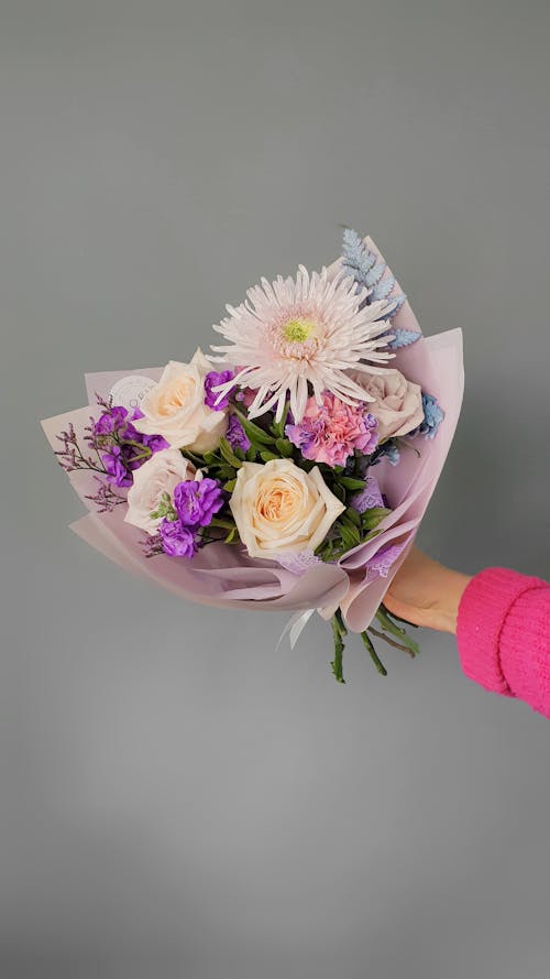 Free Colorful Flowers in Bouqet Held in Human Hand Stock Photo