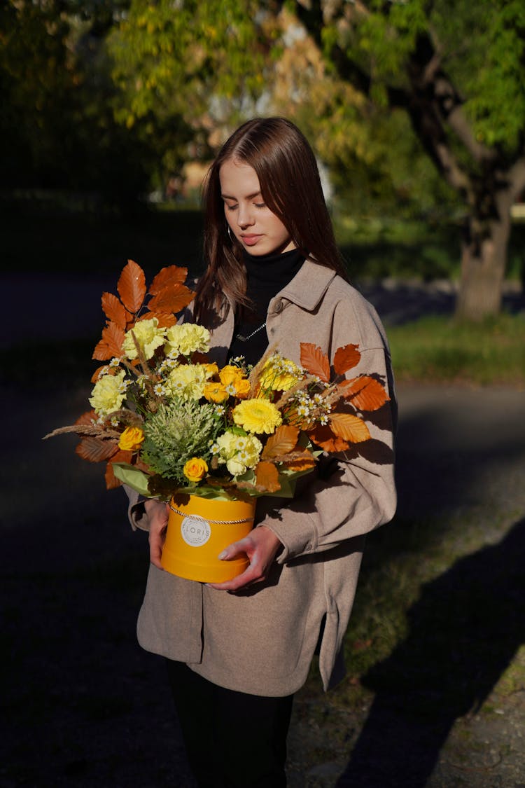 Woman Holding Box Of Flowers