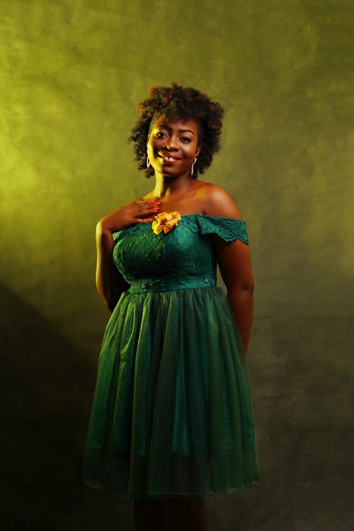 Woman in Dress Against Yellow Background