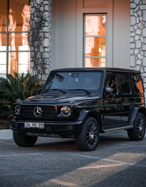 Mercedes-Benz G-Class Parked on the Side of a Street in a City · Free ...