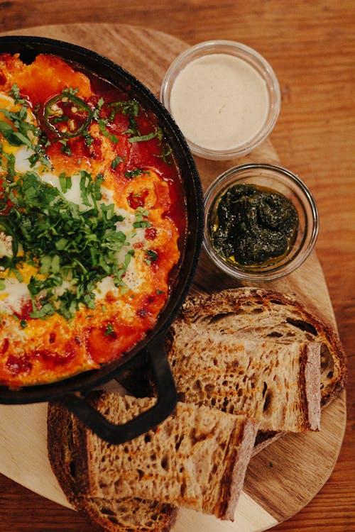 Free Shakshuka with Bread on Table Stock Photo