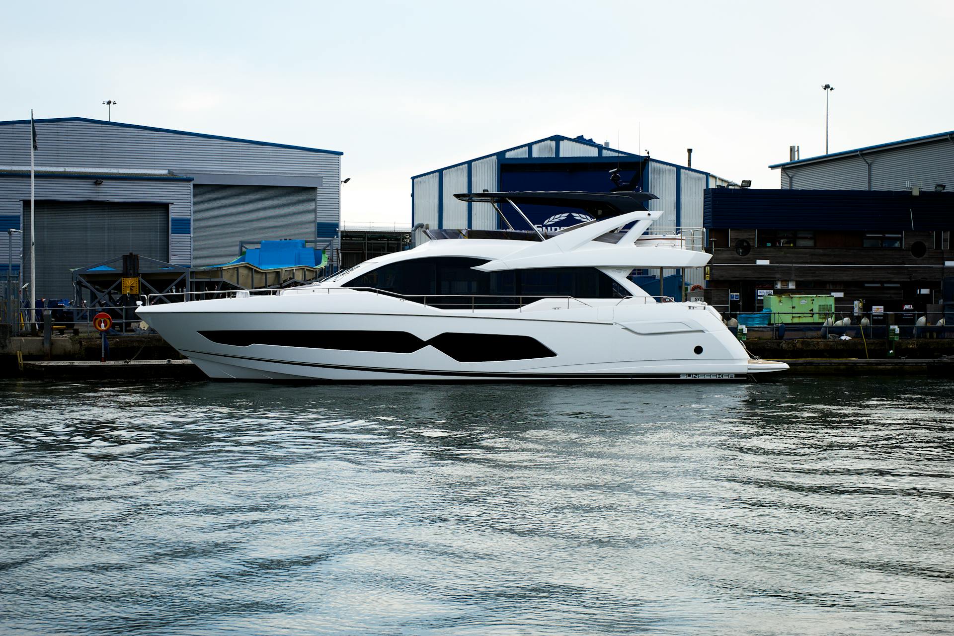 A Luxurious Yacht Docked on the Side of the Sea