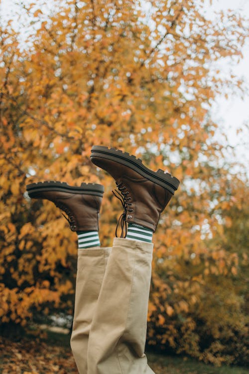Free A Person Wearing a Brown Boots and Beige Pants Stock Photo
