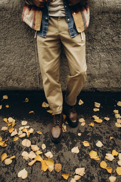 Mans Feet and Autumn Leaves 