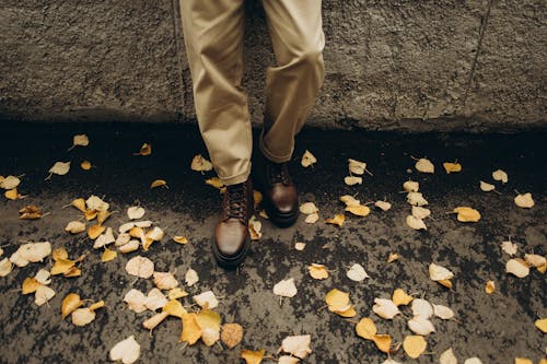 Photo of Man in Brown Blazer,Gray Pants, and Brown Boots Holding Brown ...