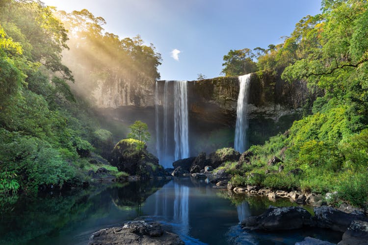 Scenic Waterfall At Sunset