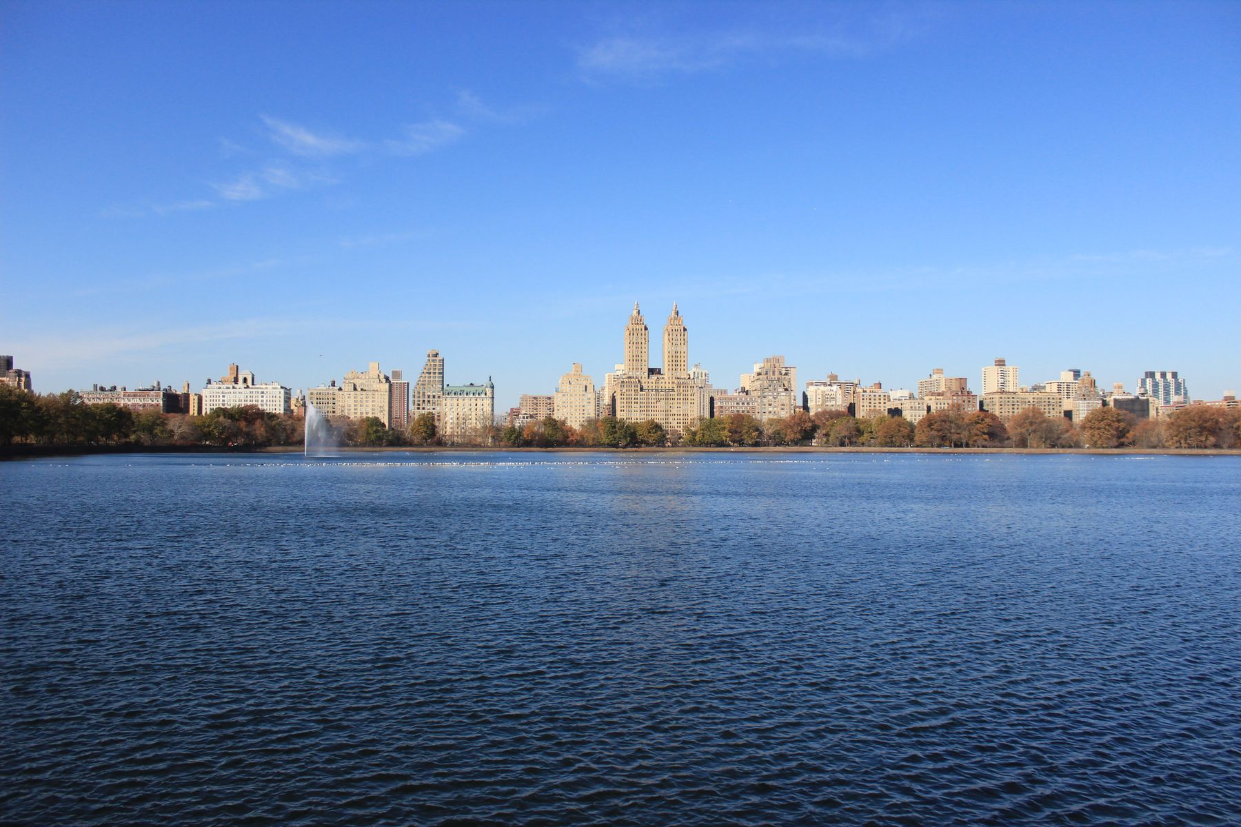The Upper West Side skyline across the Central Park Reservoir on a clear day