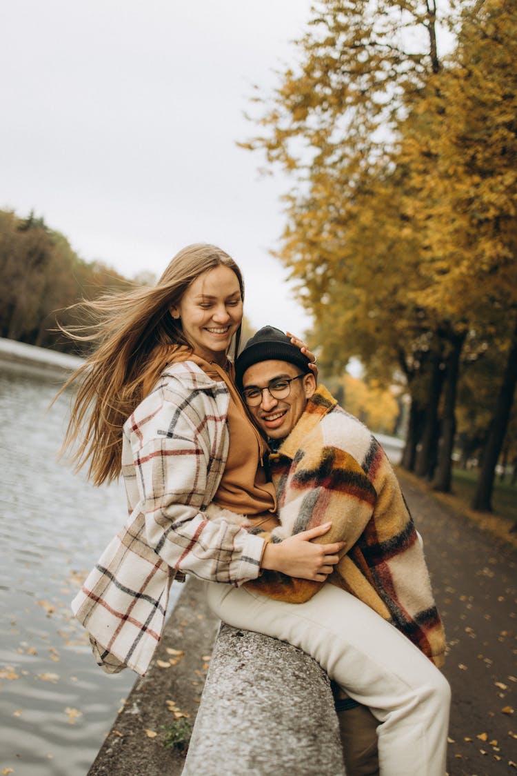 Man Hugging A Woman