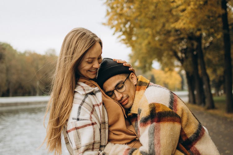 Man In Black Beanie Leaning On A Woman