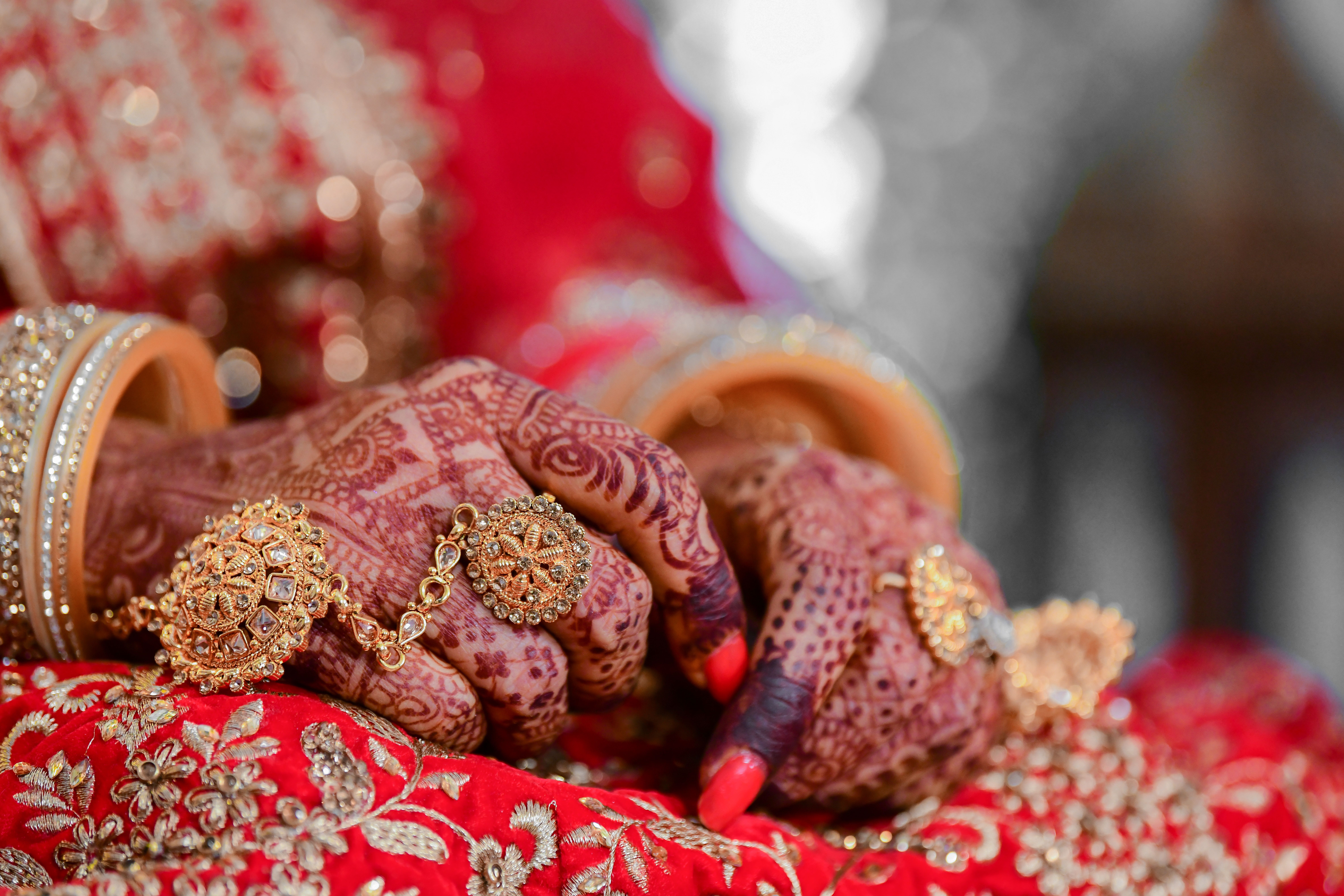 Bride hands with henna and rings