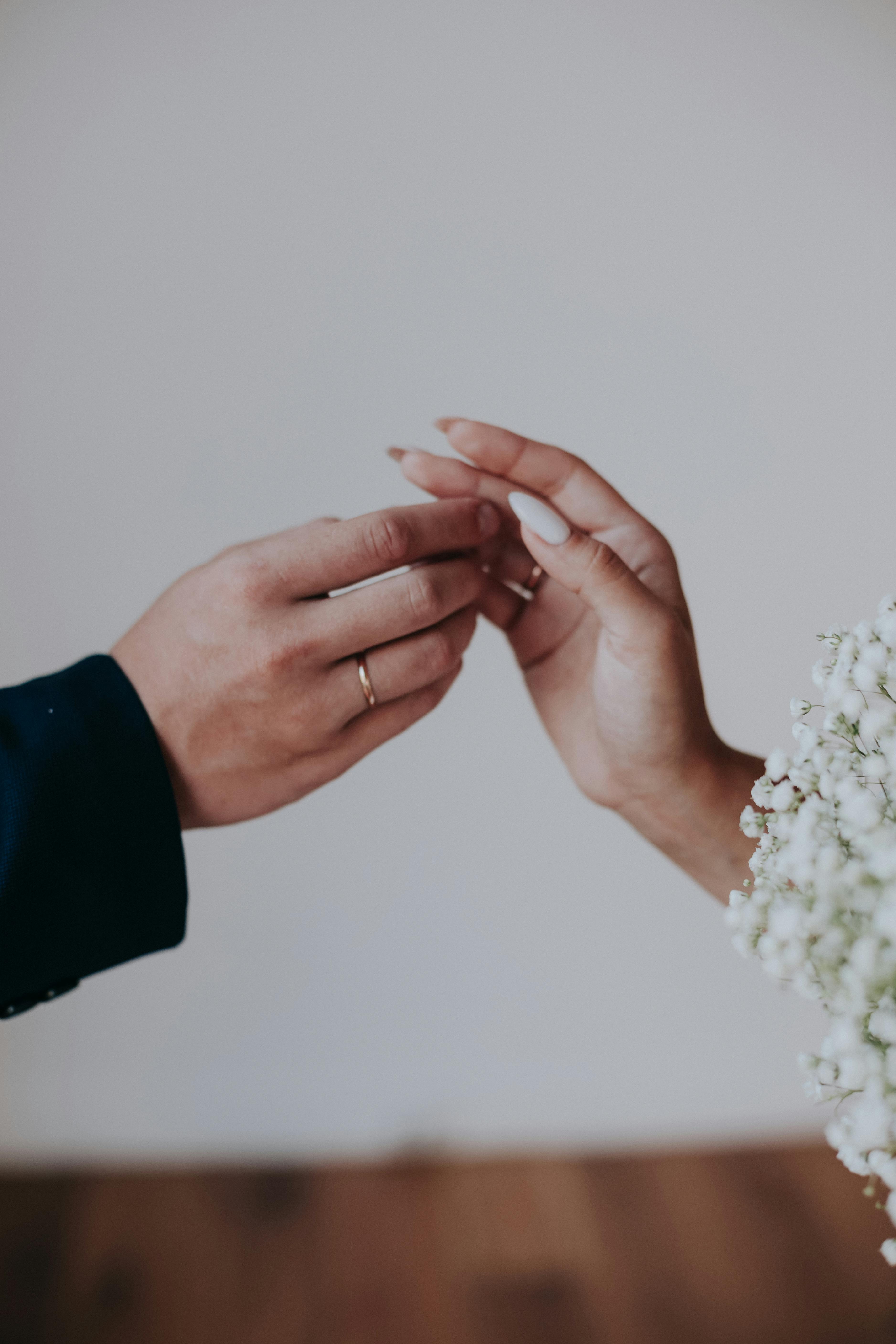 real bride and groom holding hands