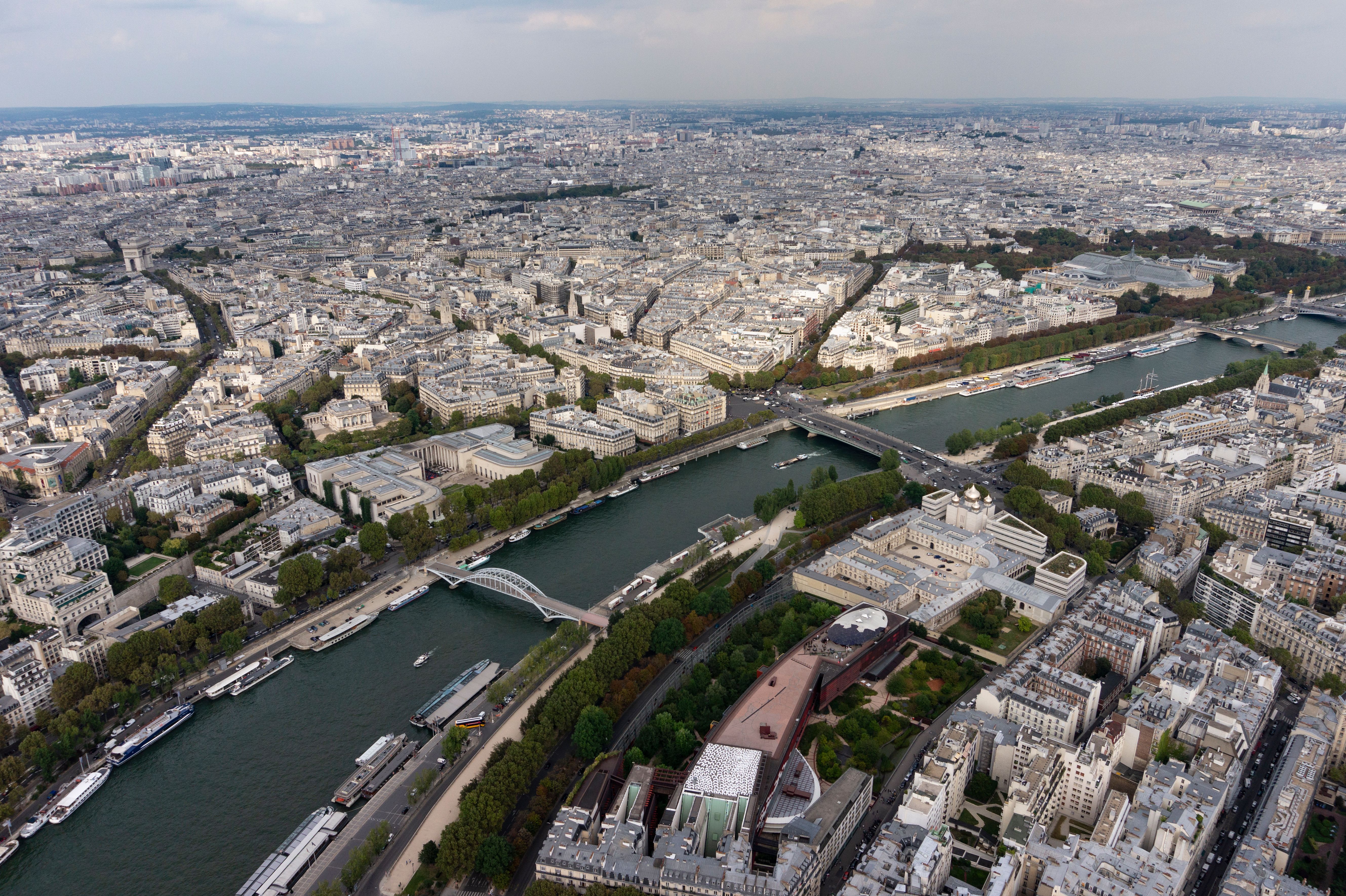 Breathtaking aerial view of Paris showcasing the iconic River Seine and urban landscape. Breathtaking aerial view of Paris showcasing the iconic River Seine and urban landscape.