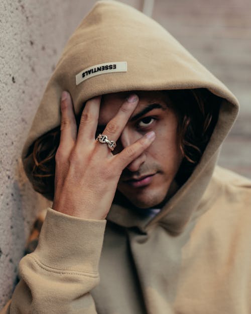 Close Up Photo of a Man Wearing Hoodie
