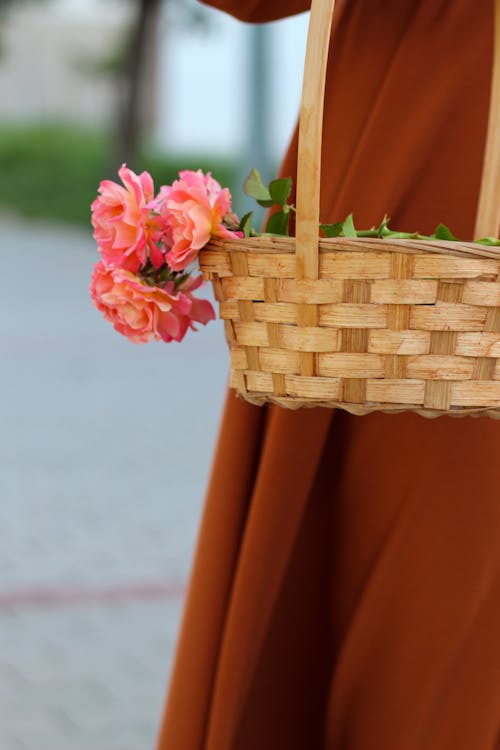 Free Stems of Pink Flower on Woven Basket Stock Photo