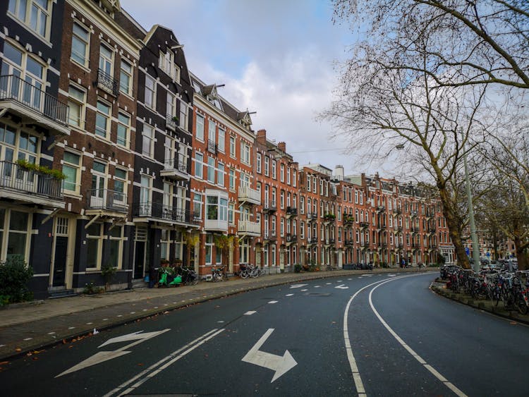 A Row Of Buildings Near The Road 