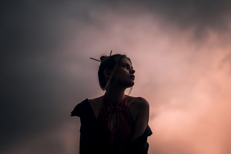 Portrait Of A Young Woman Posing Against Thick Smoke