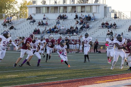 Free Exciting football match with young athletes in action on the field at an outdoor stadium. Stock Photo