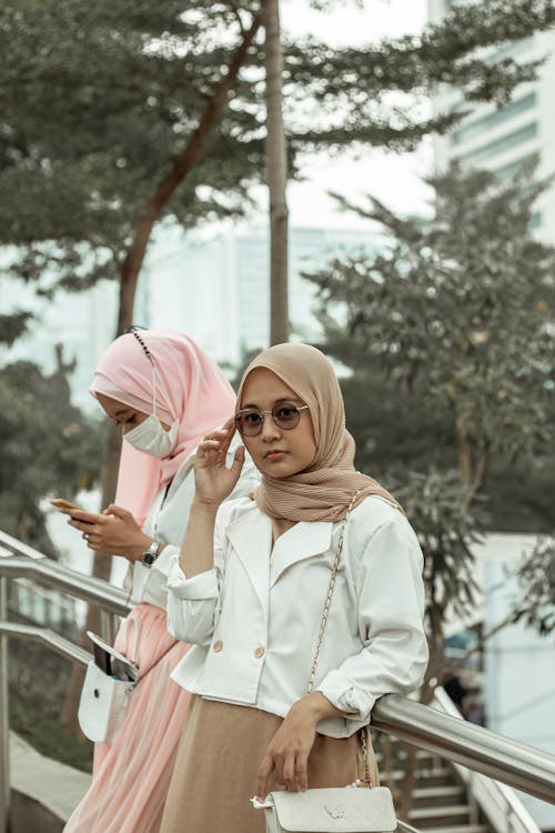 Woman in White Long Sleeve Shirt Wearing Hijab
