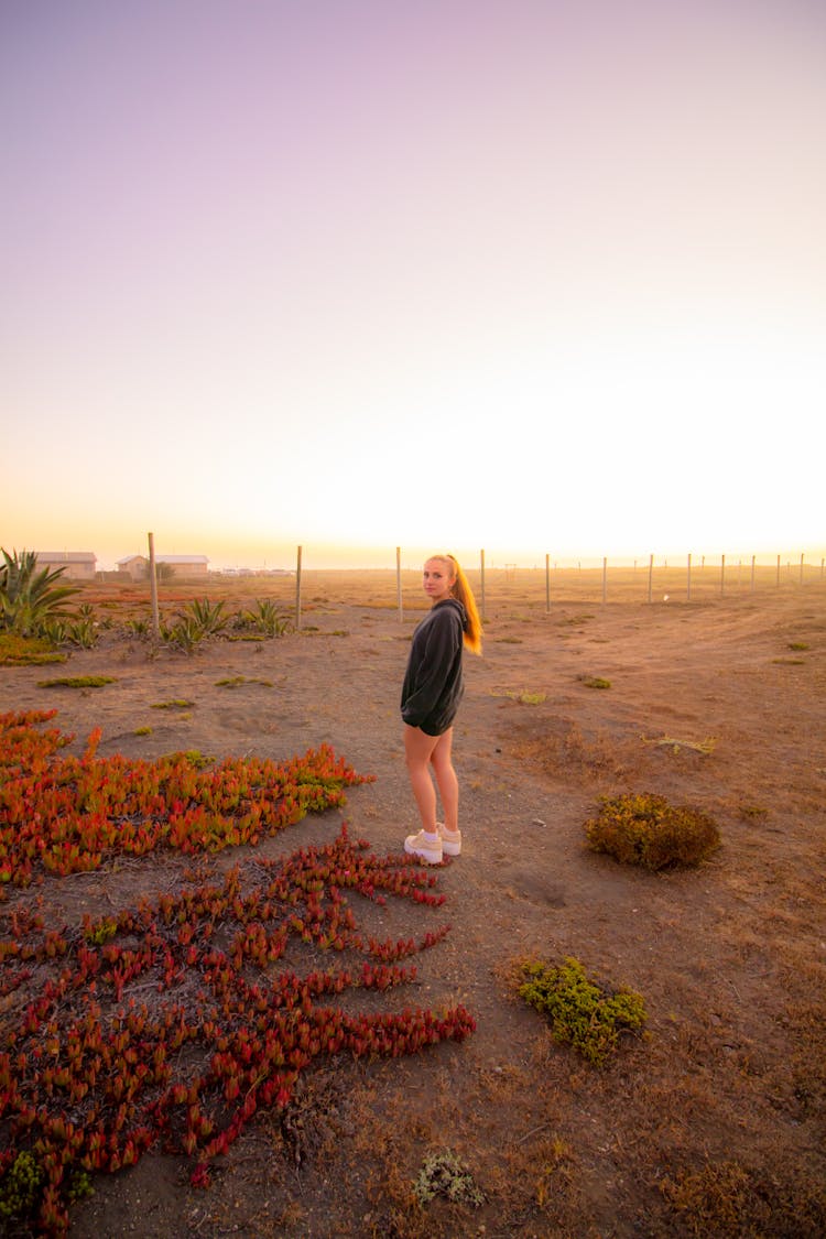 Girl Standing Near Airport At Sunset