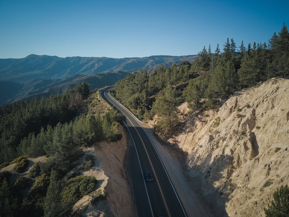 A Highway on the Mountains Near Green Trees