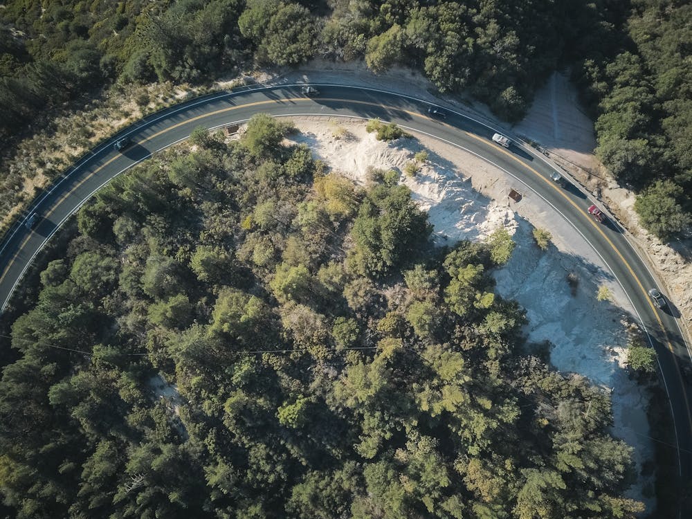 Aerial Photography of Cars on a Curve Road