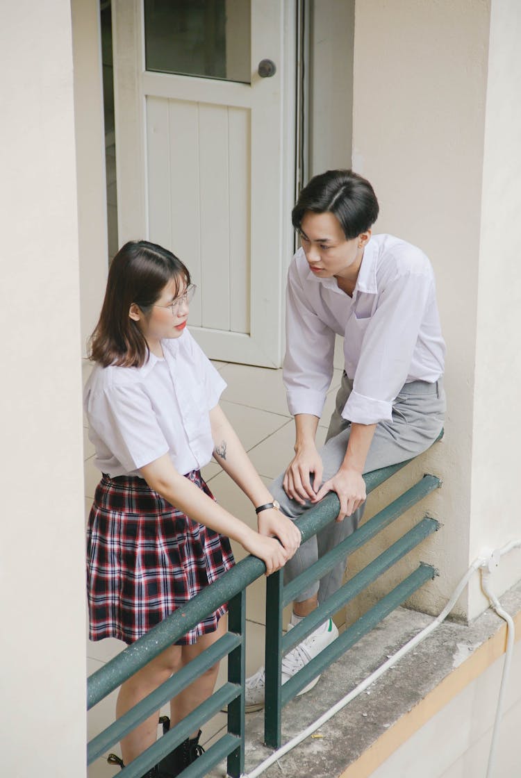 A Young Couple Talking In The Balcony