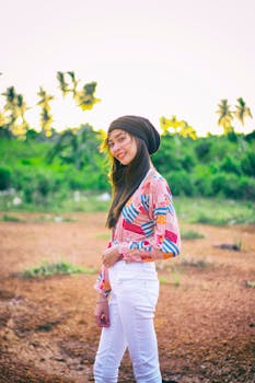 Woman Wearing Black Beanie Standing on Brown Soil Field