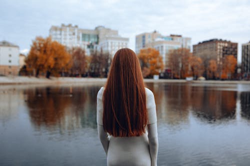 Woman Standing near Body of Water