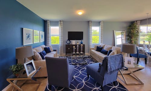 Armchair and Sofa Around Glass Coffee Table in Living Room