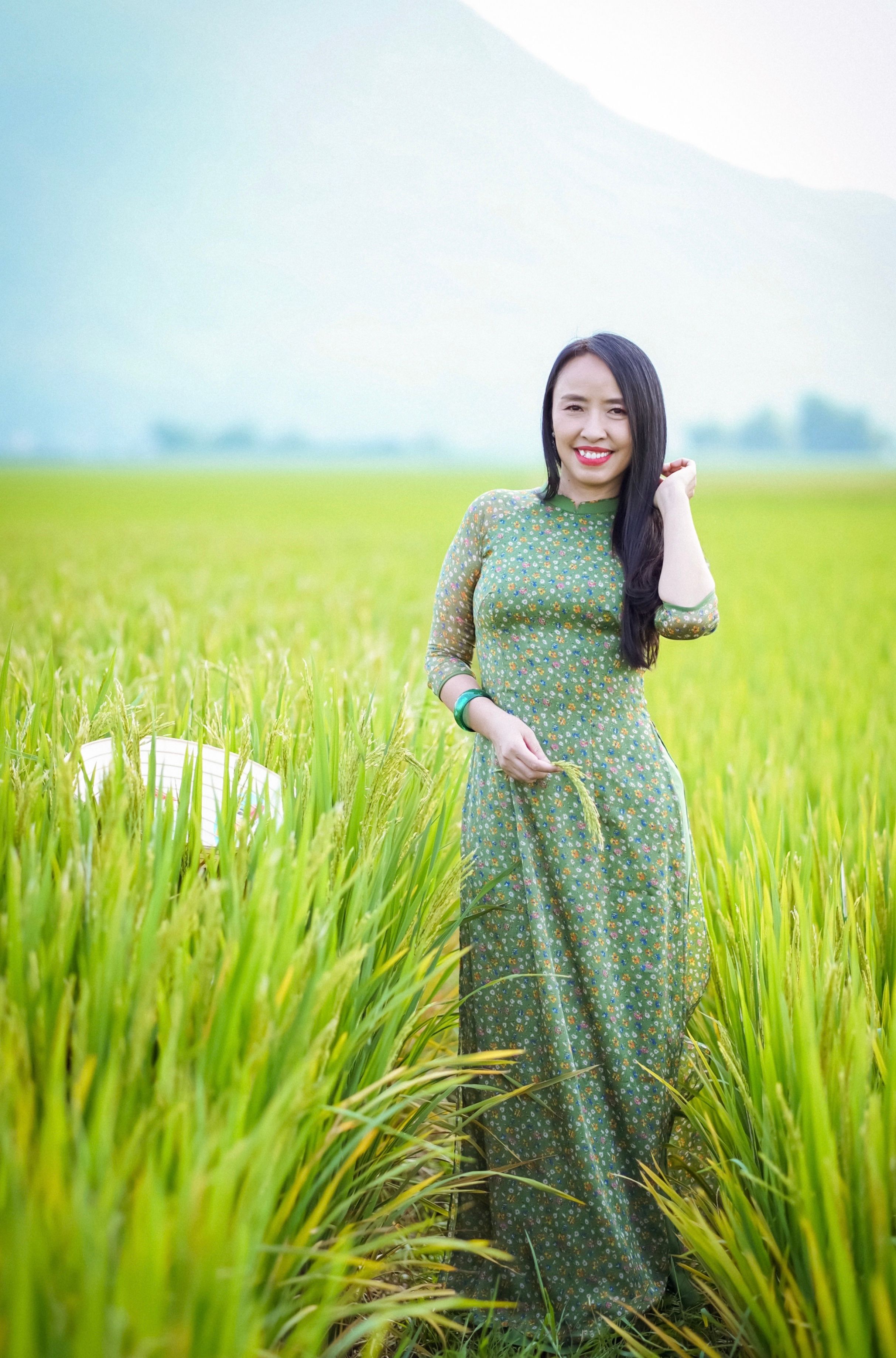 Woman in Green Dress Standing in the Field  Free Stock Photo
