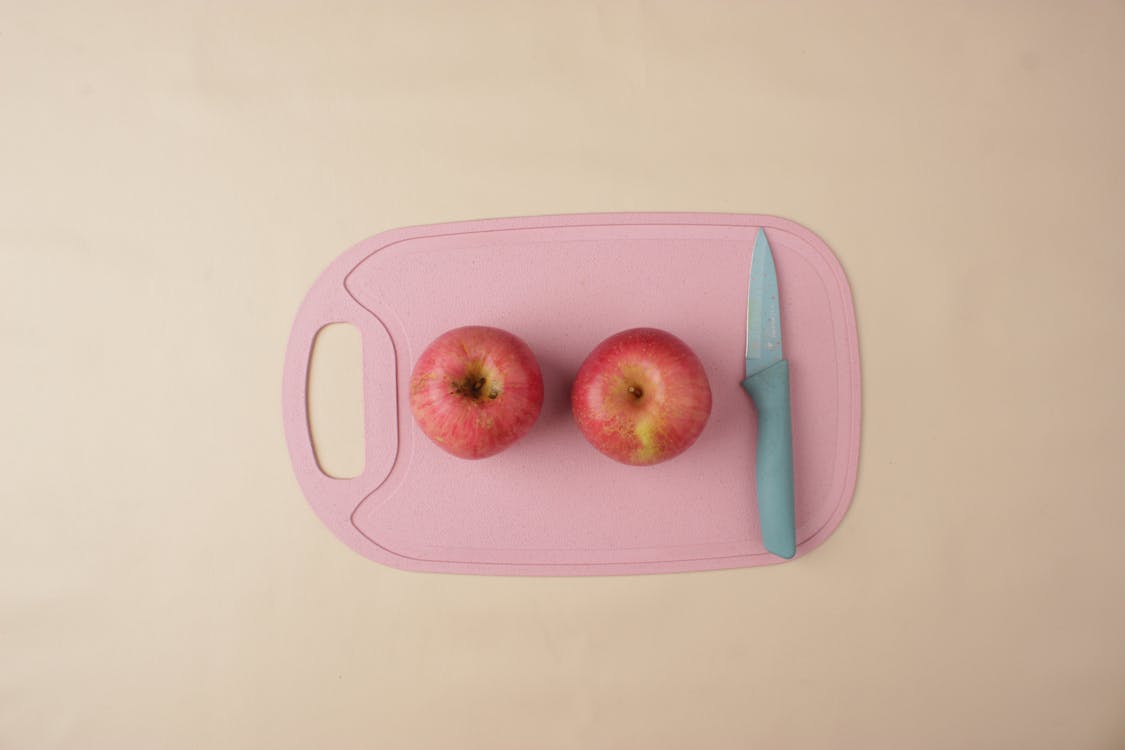 Apples on Pink Chopping Board