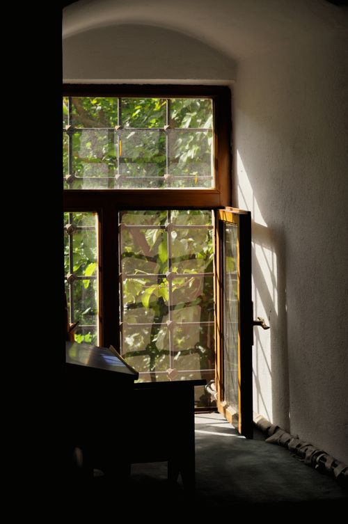 Free A charming interior scene with sunlit open door casting intricate shadows on the wall. Stock Photo