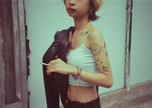 Woman in Black Jacket and White Tank Top