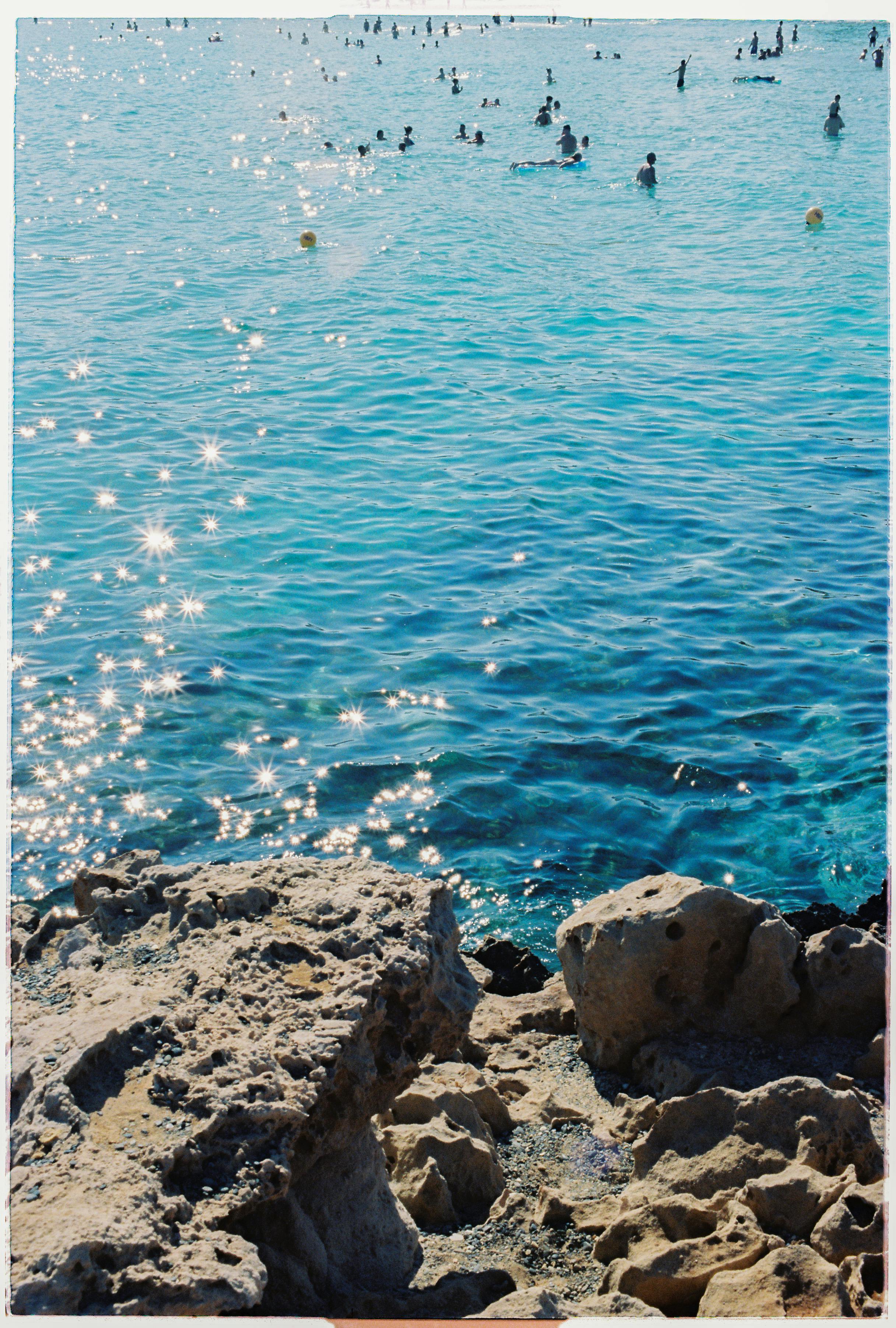 Crystal blue waters and rocky shores in sunny Cyprus make the perfect beach day.